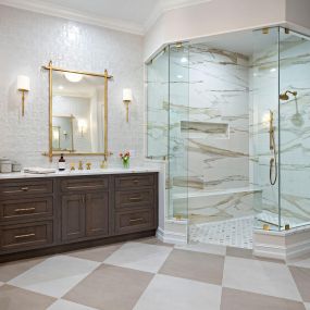 Beautiful Master Bathroom with Showplace Cabinetry & Calcacatta Gold Slab Shower walls