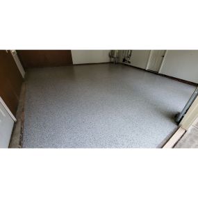 WOW! Epoxy flooring completely changed this garage for the better.