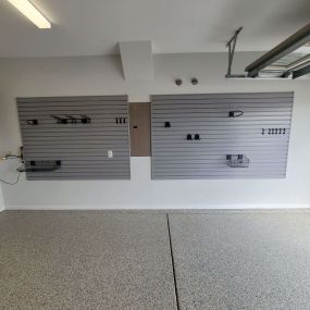 Upgrade your garage with cutting-edge polyspartic flooring, and chaos cutting slatwall!