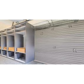 No more garage chaos! Our personalized garage storage makes cleanup a breeze, like this drop zone and custom storage. The PremierOne epoxy floor looks fabulous too!