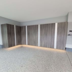 Custom cabinets in Alno finish with extruded aluminum handles and under lighting  completed a gorgeous garage makeover for our Mooresville client.