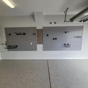 Upgrade your garage with cutting-edge polyspartic flooring, and chaos cutting slatwall!