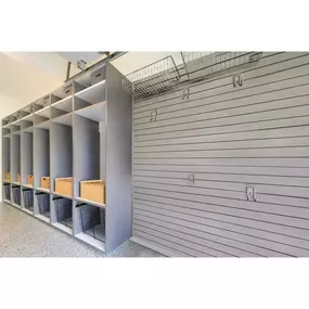 No more garage chaos! Our personalized garage storage makes cleanup a breeze, like this drop zone and custom storage. The PremierOne epoxy floor looks fabulous too!