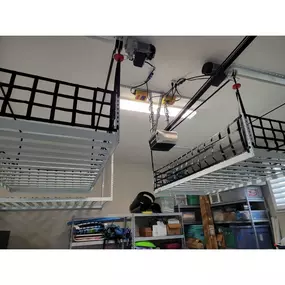 Motorized overhead storage racks provide a safe place to organize stuff away from children and pets, and they lower for loading/unloading making it safe for you because no ladders needed.