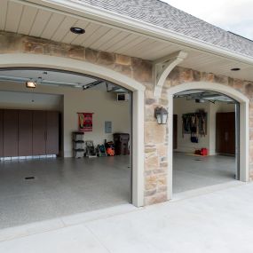 Transform your garage with protective garage floor coating, garage cabinets, overhead storage, garage lighting and more—and make your garage a true extension of your home. Encore Garage Ohio helps homeowners rethink this multipurpose space, revamping a messy garage into a clean, organized space.
Our garage renovation experts—full-time specialists (no part-time or seasonal employees)—install advanced epoxy floor coating systems, sturdy garage cabinetry and versatile wall and ceiling storage syste