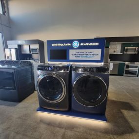 appliance showroom with washing machines on display