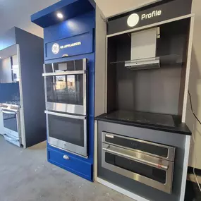 appliance showroom with built in ovens on display