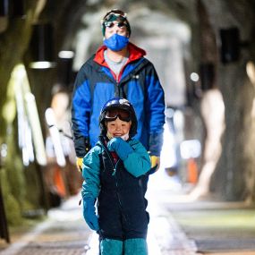 Dad and kid in Peruvian Tunnel at Snowbird