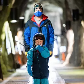 Dad and kid in Peruvian Tunnel at Snowbird
