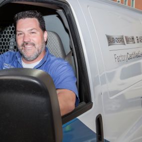 A technician in one of our service vans prepares to leave for a day of service calls.