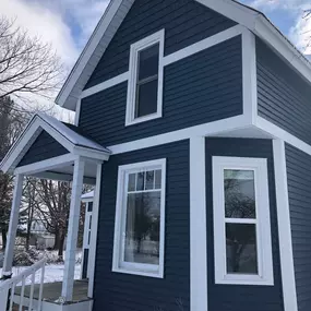 James Hardie Arctic White Trims w/ Mastic Carvedwood vinyl siding in Rock Harbor