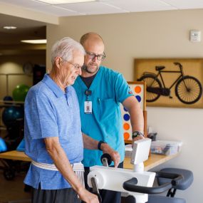 Resident with physical therapist