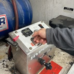 Switching on the industrial vacuum used for air duct cleaning.