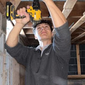 Securing an air vent after professional cleaning.