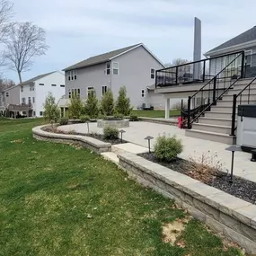Elevated deck next to a Patio with Hot Tub