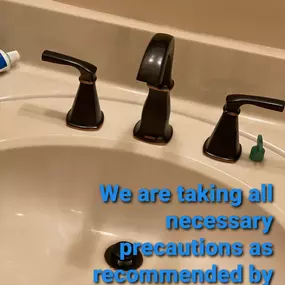 Updated bathroom faucet with text about how our company Bert Norman's Plumbing follows the CDC guidelines in Lakewood, FL.