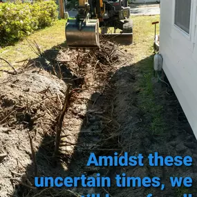 Backhoe working to fix a plumbing pipe issue near Yulee, FL.