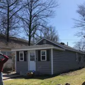 New siding, type is beaded- Granite Gray, windows, trim and gutters.