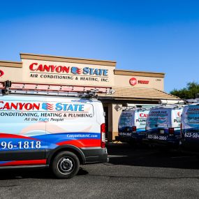 Canyon State company vehicles parked outside of company building