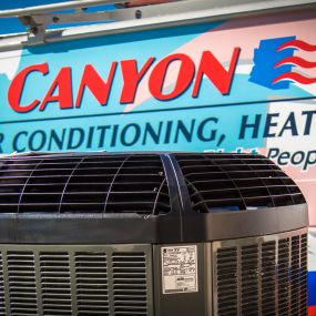 HVAC equipment sitting in front of the company van