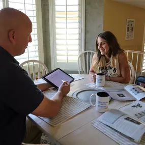 Canyon State Comfort Advisor seated with a customer.