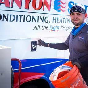 Canyon State install team member getting supplies from company vehicle