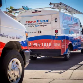 Canyon State company vehicles parked in front of residential customer house