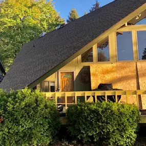 Photo of a roof installation on this ranch style a-frame home.