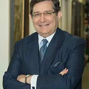 Headshot picture of Mark E. Seitelman inside his office