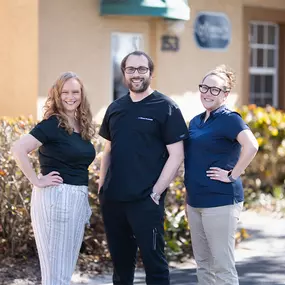 Dr. Michael Grocholski, D.C, Chrissy, LMT, and Missy, the office manager at Venice Spine and Disc in Venice, FL with a patient.