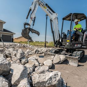 Bobcat Excavator Clamp Grabs Large Rocks