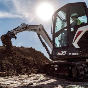 Bobcat Mini E-35 ExcavatorDigging Large Hill of Dirt