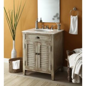 The plantation-inspired look of this cottage-style sink cabinet will add casual elegance to any bathroom decor. With shutter-style doors and faux finish, this bathroom vanity offers a look that will create a relaxing retreat in any home.