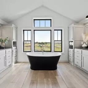 In our humble opinion this Owners Bathroom has 7 things that you just shouldn't live without!
His and Hers Vanities. Large Soaking Tub. Walk in Shower. Make-Up Vanity. Access to a Walk-In Closet. Direct access to the Laundry Room. Separate Toilet Room