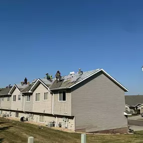 Signs that you should replace your roof include missing or cracked shingles, leaks, excessive granule loss, sagging, and age