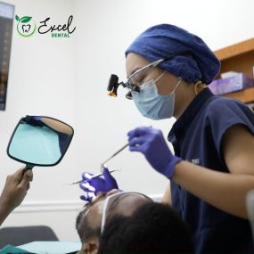 Dentist treating a patient at Excel dental