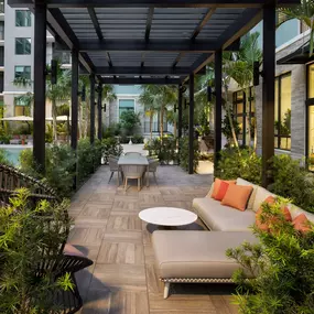 Pool lounge area at Camden Atlantic apartments in Plantation, Florida.