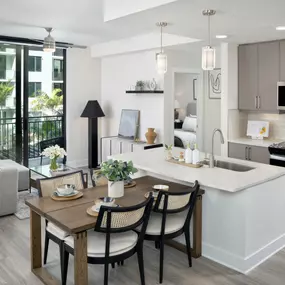 Kitchen, dining, and living room at Camden Atlantic apartments in Plantation, Florida.