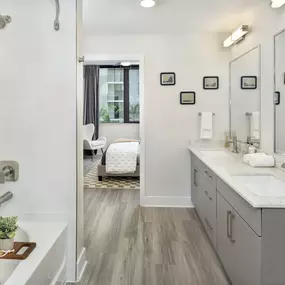 Double sink vanity and oversized bathtub at Camden Atlantic apartments in Plantation, Florida.