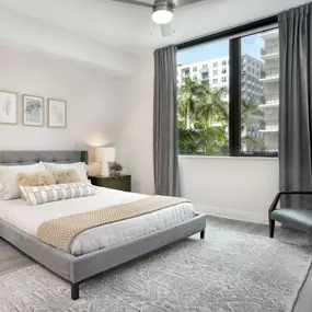 Bedroom with lighted ceiling fan at Camden Atlantic apartments in Plantation, Florida.