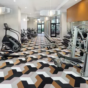 24-hour athletic club with strength training equipment at Camden Atlantic apartments in Plantation, Florida.