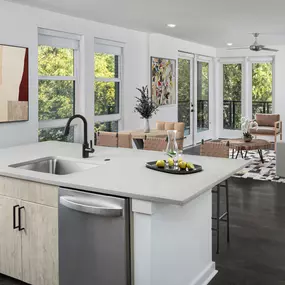 Natural modern kitchen overlooking living area at Camden Noda in Charlotte, NC