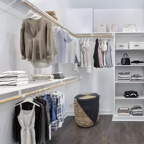 Closet with built-in wood shelving and storage at Camden NoDa in Charlotte North Carolina