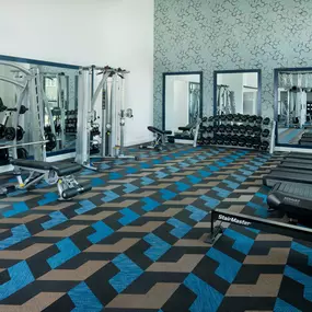 Camden NoDa apartments in Charlotte Athletic Club with free weights and cardio machines