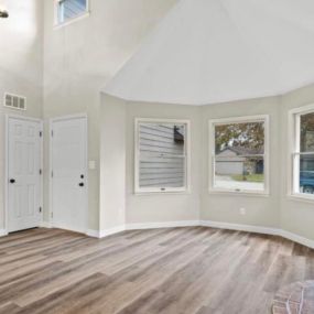 Living room renovation hardwood flooring by Heartland Homes