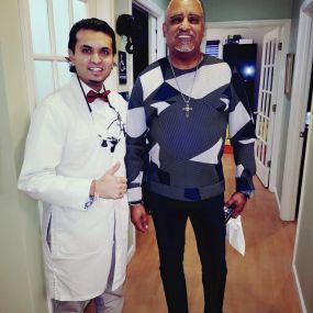 Dr patel picture with happy client