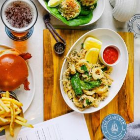 The Helmsman table of entrees - pasta, burger with fries & more