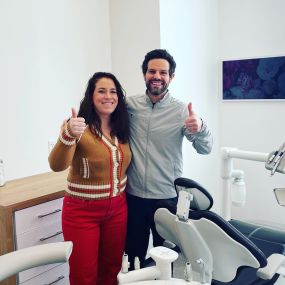 Dr. Pallotto and patient giving a thumbs up