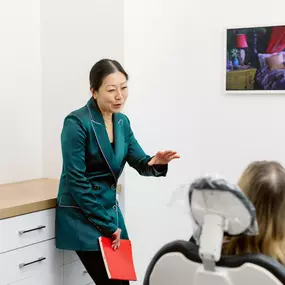 Dr. Josephine Pallotto speaking with a MADE Dental Implant Center patient