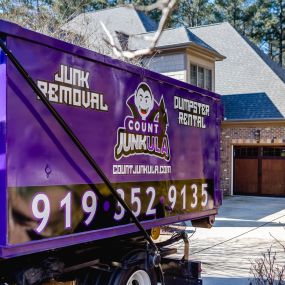 count junkula of raleigh branded dumpster parked